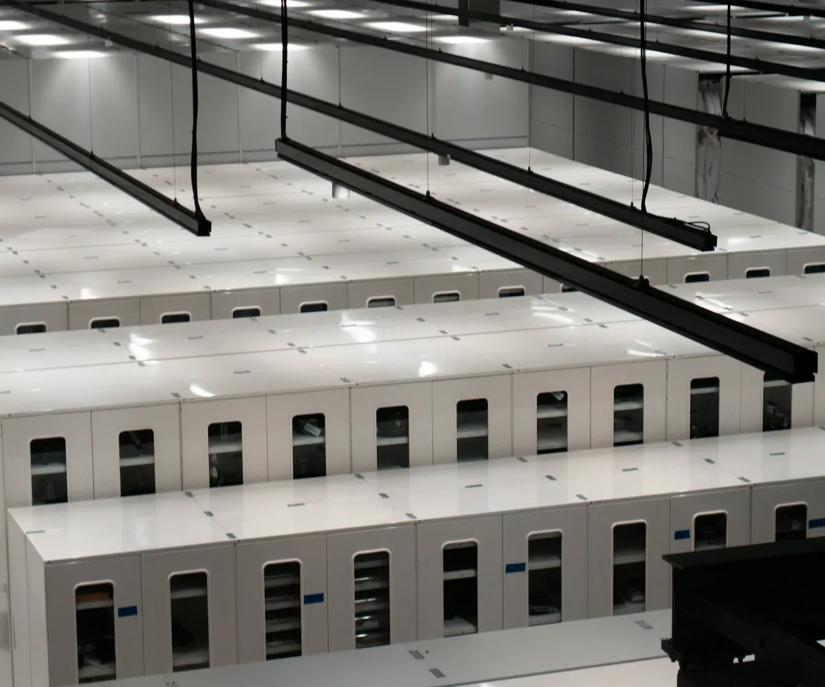 Rows of server cabinets in a data centre.